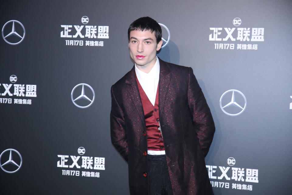 Ezra Miller rocked up to the ‘Justice League’ red carpet wearing Fenty Beauty lip gloss [Photo: Getty]