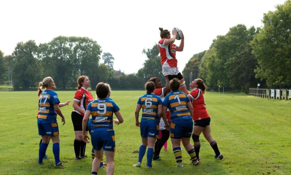 Amateur female rugby union players contest a lineout in Leamington Spa.