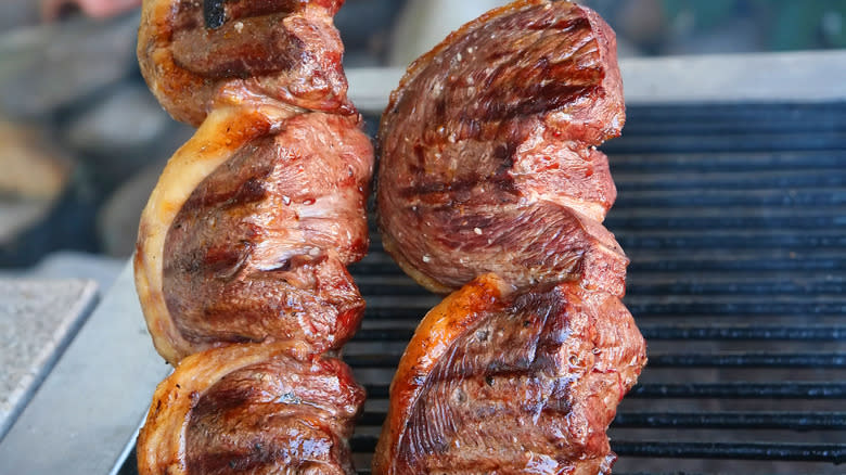 Skewer of picanha being grilled 