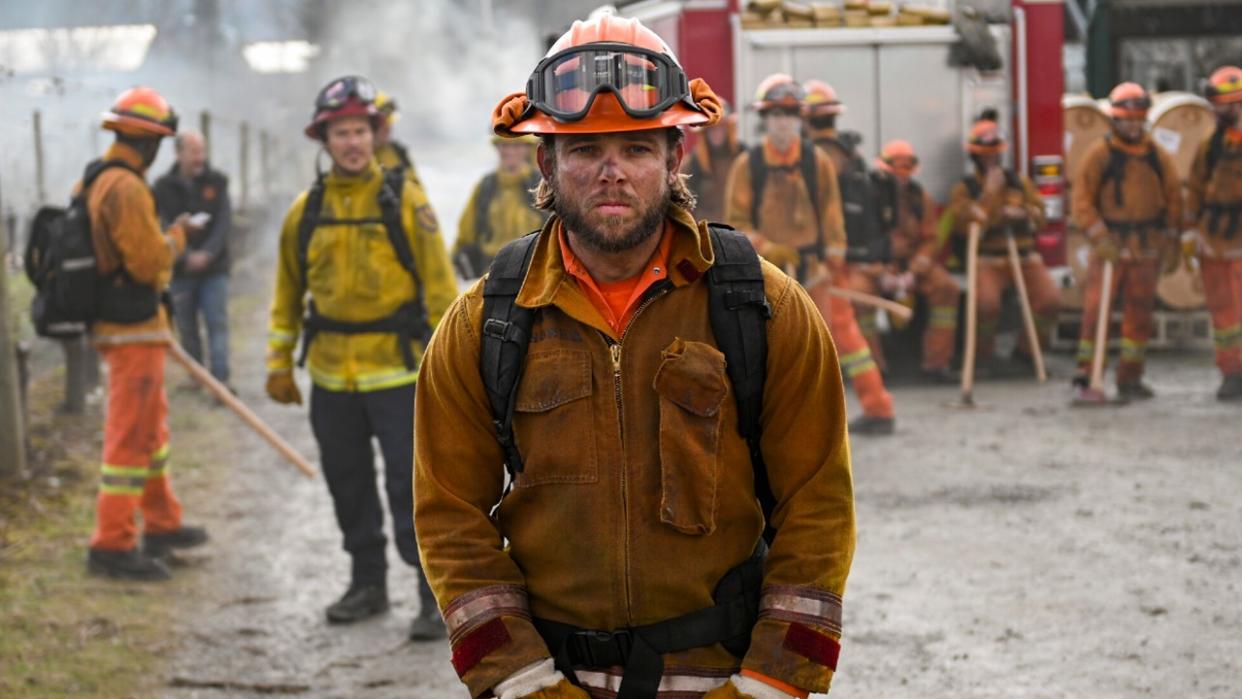  Max Thieriot in his fire gear on Fire Country. 