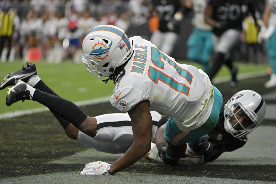 Las Vegas Raiders cornerback Casey Hayward (29) tackles Miami Dolphins wide receiver Jaylen Waddle (17) for a safety during the first half of an NFL football game, Sunday, Sept. 26, 2021, in Las Vegas. (AP Photo/David Becker)