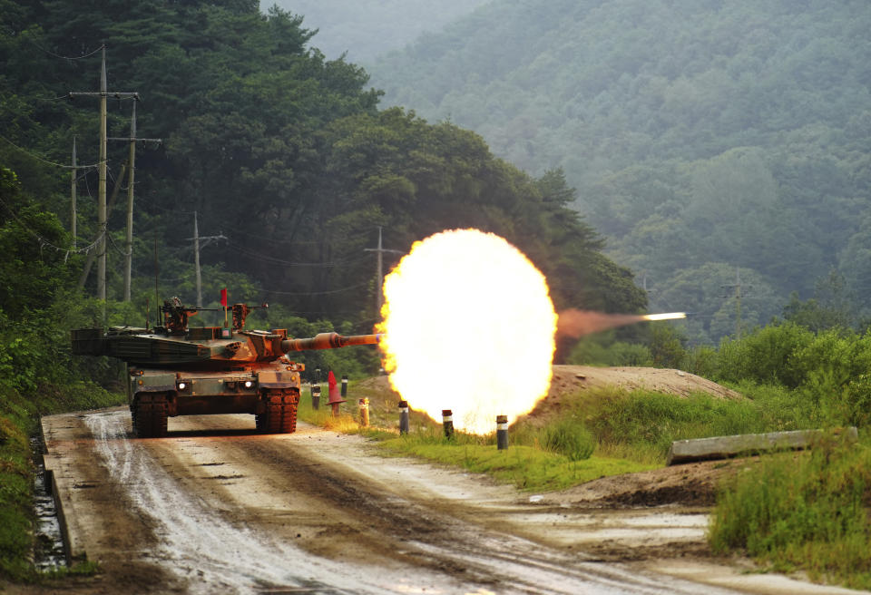 In this photo provided by South Korea Defense Ministry, a South Korean army's K1A2 tank fires during a drill as part of South Korea and the United States' joint annual military exercise, the Ulchi Freedom Shield, at a training filed in Cheorwon, South Korea, Wednesday, Aug. 30, 2023. (South Korea Defense Ministry via AP).