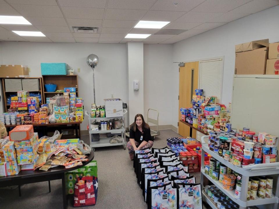AdventHealth Heart of Florida Volunteer Services Manager Julie Sing gets ready to pack more than 4,100 food items AdventHealth team members donated to Loughman Oaks Elementary School’s food insecurity program for students and their families.
