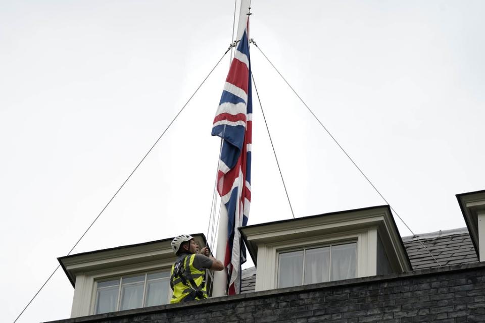 The Union flags above Downing Street have been lowered to half mast (Aaron Chown/PA) (PA Wire)