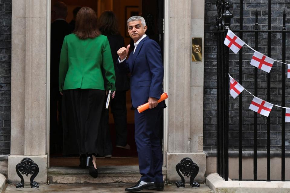 London Mayor Sadiq Khan gestures outside Downing Street (REUTERS)