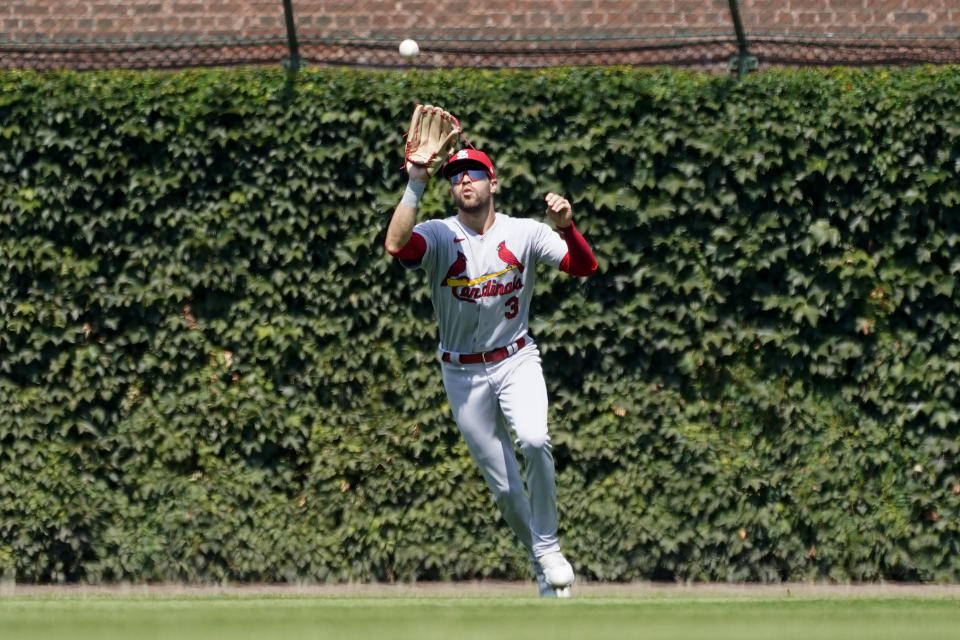 St. Louis Cardinals center fielder Dylan Carlson catches a fly ball from Chicago Cubs' Rafael Ortega during the third inning of a baseball game Tuesday, Aug. 23, 2022, in Chicago. (AP Photo/Charles Rex Arbogast)