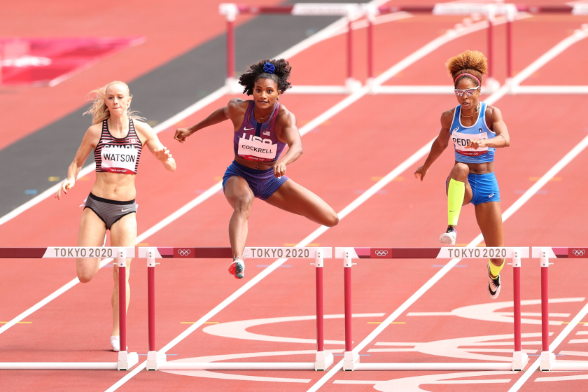 TOKYO, JAPAN - JULY 31: Anna Cockrell (center) of Team United States competes against Sage Watson of Team Canada.