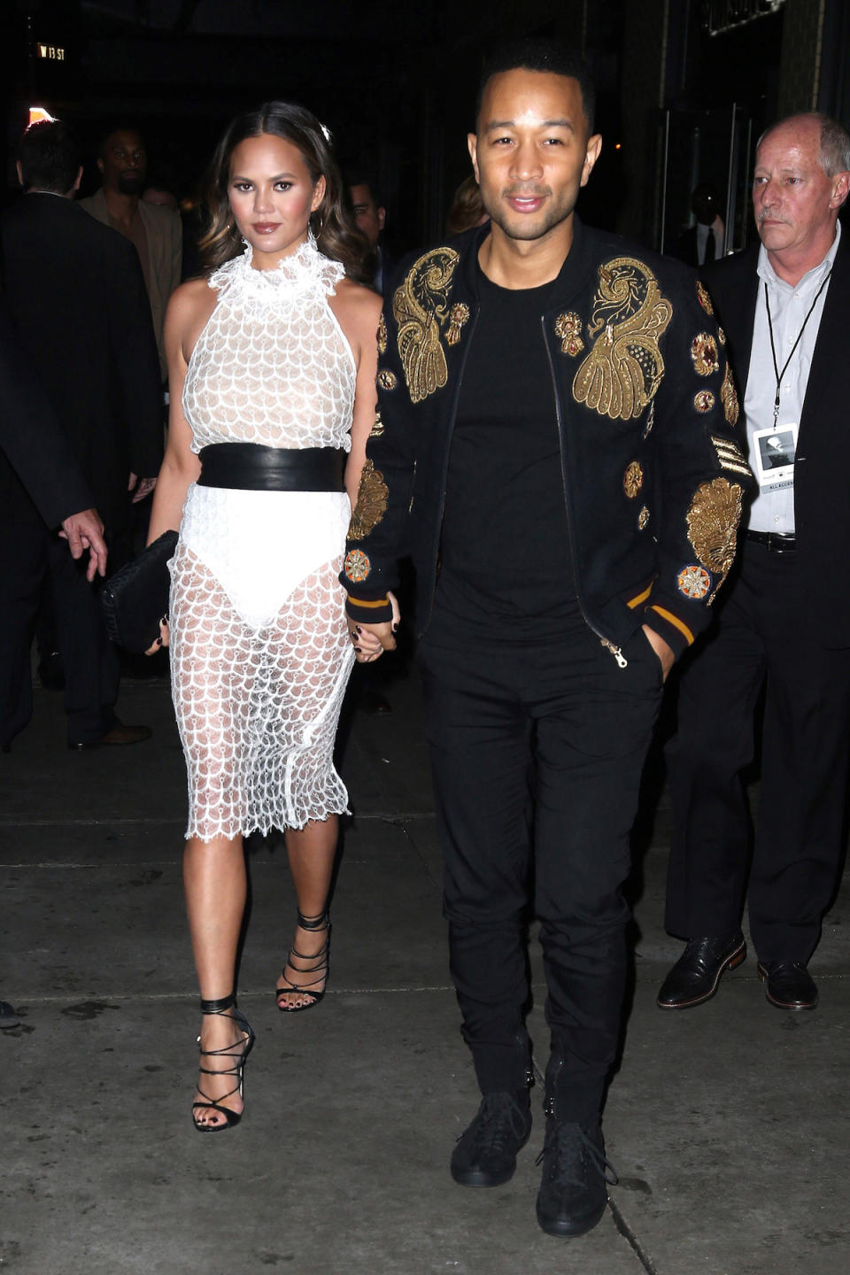 Chrissy Teigen wears a dress from Zeynep Arçay while out with husband John Legend in New York City in November.