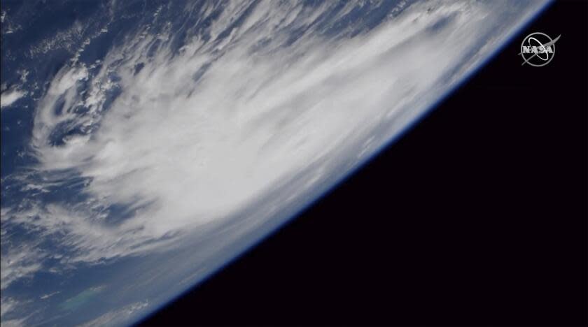 This Friday, Aug. 30, 2019 image provided by NASA shows a view of Hurricane Dorian from the International Space Station as it churned over the Atlantic Ocean. Hurricane Dorian is strengthening as it moves west toward the Bahamas and Florida. The National Hurricane Center in Miami says maximum sustained winds increased Saturday, Aug. 31 morning to 145 mph (230 kph), up from 140 mph (220 kph). (NASA via AP)