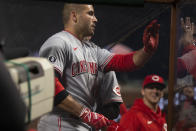 Cincinnati Reds first baseman Joey Votto (19) is greeted by his teammates after hitting a solo home run against the San Francisco Giants during the sixth inning of a baseball game, Monday, April 12, 2021, in San Francisco, Calif. (AP Photo/D. Ross Cameron)