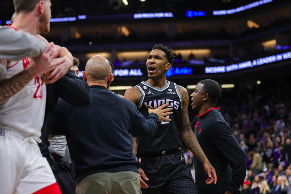 Jan 13, 2023; Sacramento, California, USA; Houston Rockets guard Garrison Mathews (25) is confronted by Sacramento Kings guard Malik Monk (0) during the fourth quarter at Golden 1 Center. Both players were ejected from the game. Mandatory Credit: Sergio Estrada-USA TODAY Sports