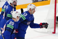 United States Nick Bonino, centre, celebrates with teammates after scoring his side's second goal during the group A match between United States and Hungary at the ice hockey world championship in Tampere, Finland, Sunday, May 14, 2023. (AP Photo/Pavel Golovkin)