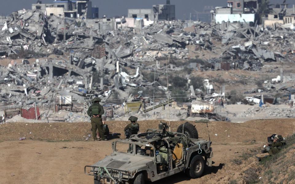 Israeli soldiers patrol the border near the Shujaiya neighbourhood in the Gaza Strip, reduced to rubble during the invasion of the enclave
