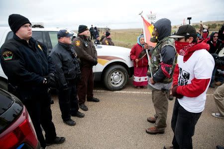 Dakota Access Pipeline protesters square off against police between the Standing Rock Reservation and the pipeline route outside the little town of Saint Anthony, North Dakota, U.S., October 5, 2016. REUTERS/Terray Sylvester/File Photo