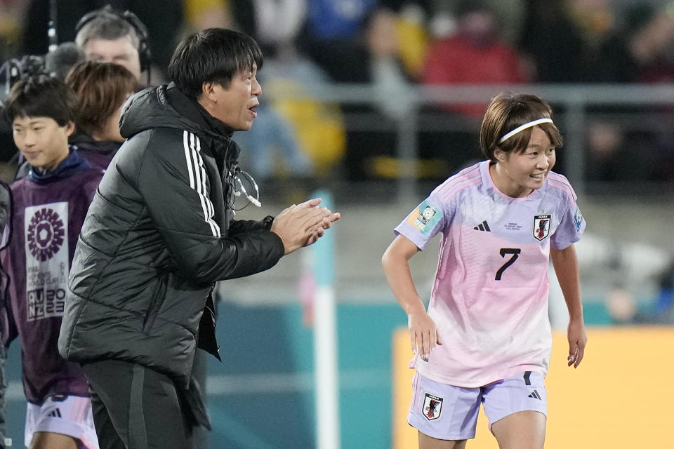 Japan's Hinata Miyazawa, right, celebrates after scoring her side's third goal beside Japan's head coach Futoshi Ikeda, left, during the Women's World Cup second round soccer match between Japan and Norway in Wellington, New Zealand, Saturday, Aug. 5, 2023. (AP Photo/Alessandra Tarantino)