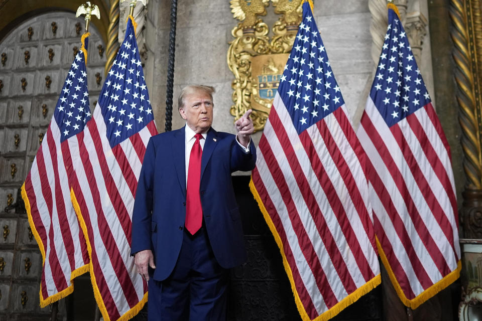 Republican presidential candidate former President Donald Trump points to a reporter for a question as he speaks at his Mar-a-Lago estate, Monday, March 4, 2024, in Palm Beach, Fla. The Supreme Court unanimously restored Trump to 2024 presidential primary ballots, rejecting state attempts to ban him over the Capitol riot. (AP Photo/Rebecca Blackwell)