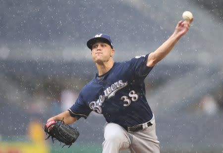 Jul 15, 2018; Pittsburgh, PA, USA; Milwaukee Brewers relief pitcher Dan Jennings (38) pitches against the Pittsburgh Pirates during the tenth inning at PNC Park. Pittsburgh won 7-6 in ten innings. Mandatory Credit: Charles LeClaire-USA TODAY Sports