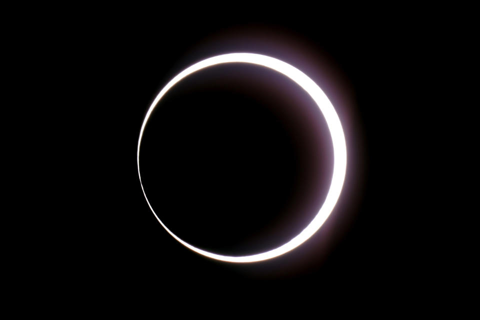 FILE - The moon passes between Earth and the sun during a rare "ring of fire" eclipse seen from Bryce Canyon National Park, Utah, Oct. 14, 2023. A romance that united sports and music fans, a celestial wonder that drew millions of eyes skyward and a long overdue homecoming for some Native American tribes were just some of the moments that inspired us and brought joy in 2023. (AP Photo/Rick Bowmer, File)