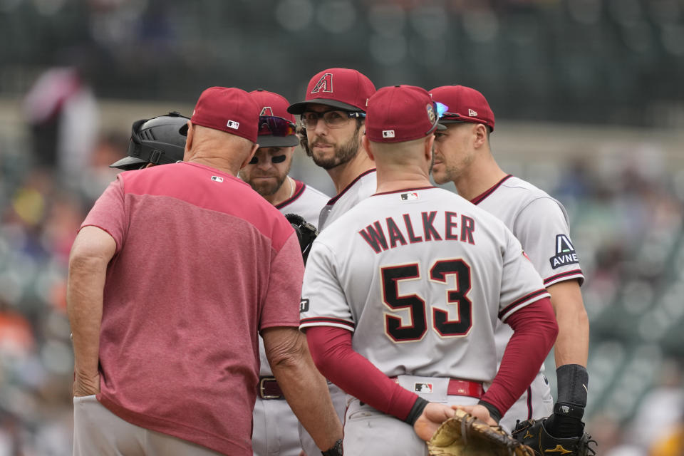 Arizona Diamondbacks pitching coach Brent Strom talks to starting pitcher Zac Gallen during the fourth inning of a baseball game against the Detroit Tigers, Sunday, June 11, 2023, in Detroit. (AP Photo/Carlos Osorio)