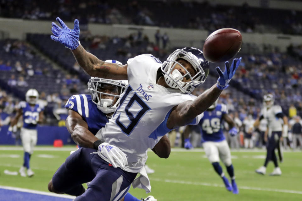 FILE - In this Nov. 18, 2018, file photo, Tennessee Titans' Tajae Sharpe (19) makes a touchdown catch against Indianapolis Colts' Kenny Moore during the second half of an NFL football gam, in Indianapolis. After the departure of Stefon Diggs, the Vikings have turned to Sharpe to fill a startling void at wide receiver. (AP Photo/Michael Conroy, File)