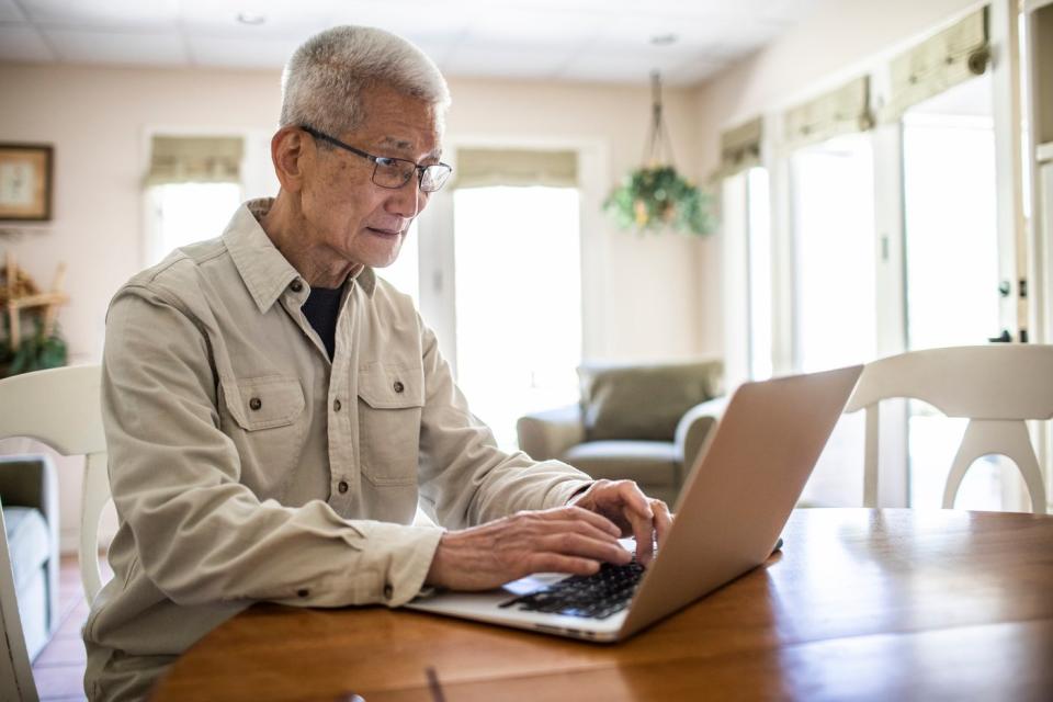 Person typing on a laptop.