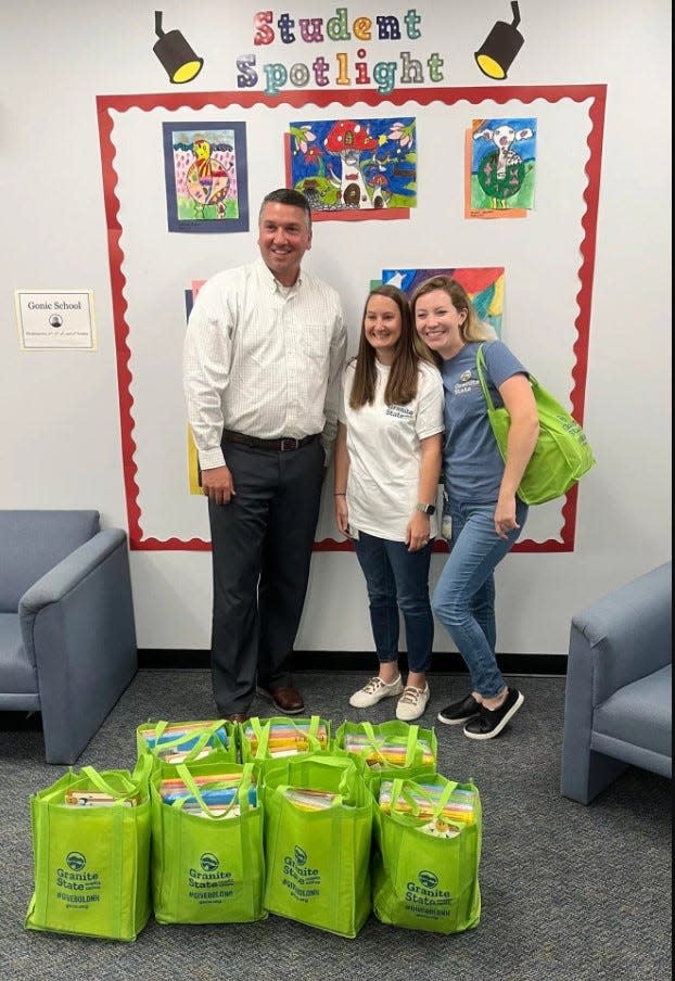 Callie Ficek and Tasha Pendergast from Granite State Credit Union drop off school supplies at the Gonic School.