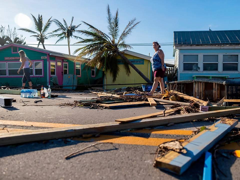 Donna LaMountain, 51, surveys damage on Pine Island Road on Thursday, Sept. 29, 2022, in Matlacha after Hurricane Ian made landfal