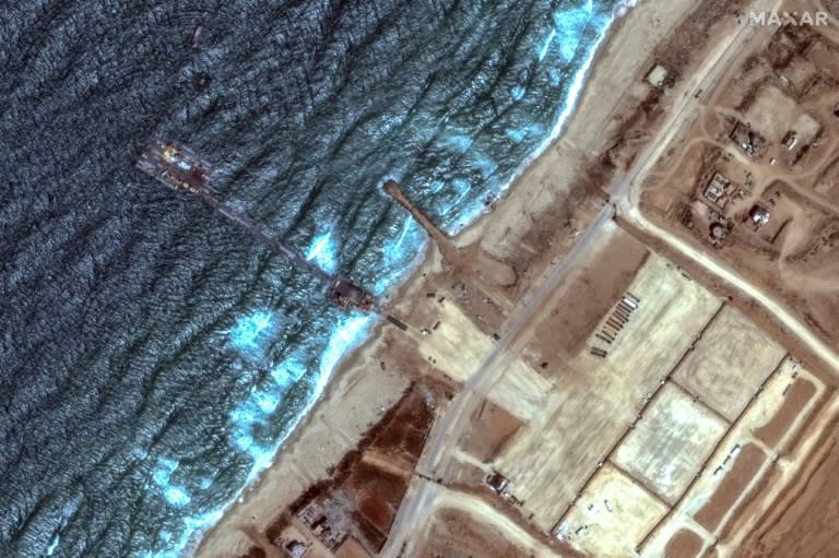 The US-built temporary pier on the coast of Gaza was washed away but has been repaired and reinstalled, the Pentagon says (-)