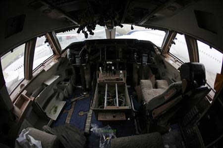 A view of the cockpit inside a Boeing 747 set to be dismantled in the recycling yard of Air Salvage International (ASI) in Kemble, central England November 27, 2013. REUTERS/Stefan Wermuth