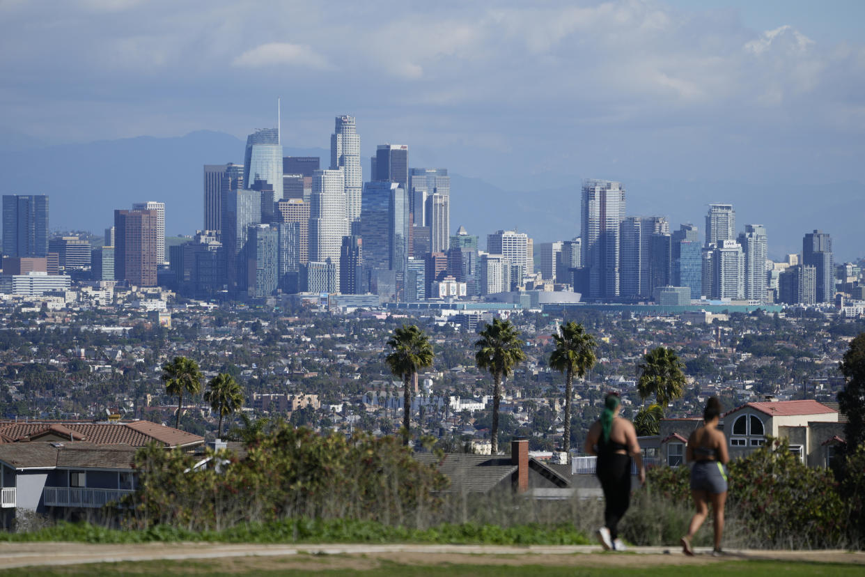 Storm clouds blanket the Los Angeles skyline as seen from Kenneth Hahn State Recreation Area following a rainstorm in Los Angeles Tuesday, Jan. 17, 2023. (AP Photo/Damian Dovarganes)