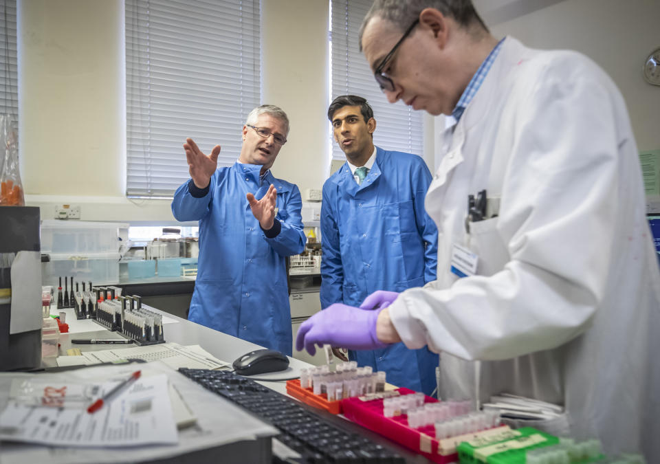 Chancellor Rishi Sunak is shown the testing of samples for respiratory viruses by Dr Antony Hale (L) during a visit to the pathology labs at Leeds General Infirmary on March 12, 2020 in Leeds, England. This is the same procedure that will be used by the lab when it begins to receive coronavirus samples for testing. Photo: by Danny Lawson - WPA Pool/Getty Images