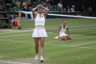 Barbora Strycova of the Czech Republic, rear, and Taiwan's Hsieh Su-Wei after beating Australia's Storm Hunter and Belgium's Elise Mertens to win the final of the women's doubles on day fourteen of the Wimbledon tennis championships in London, Sunday, July 16, 2023. (AP Photo/Alastair Grant)