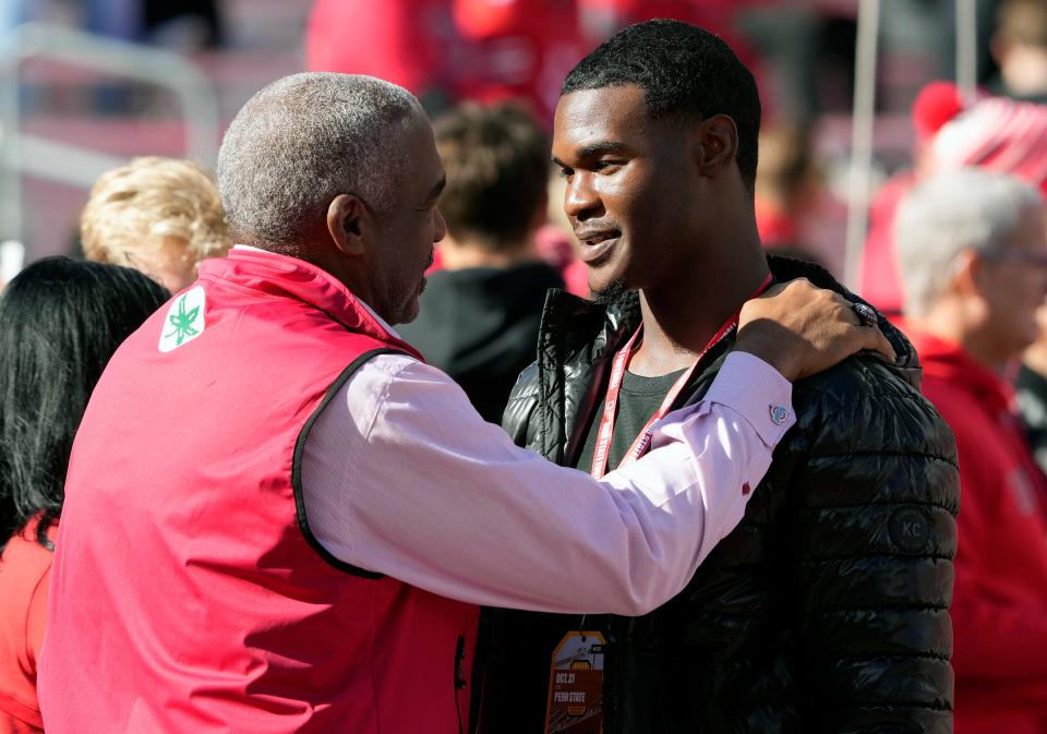 Ohio State athletic director Gene Smith talks to 2024 quarterback commit Air Noland before the school's game against Penn State at Ohio Stadium.
