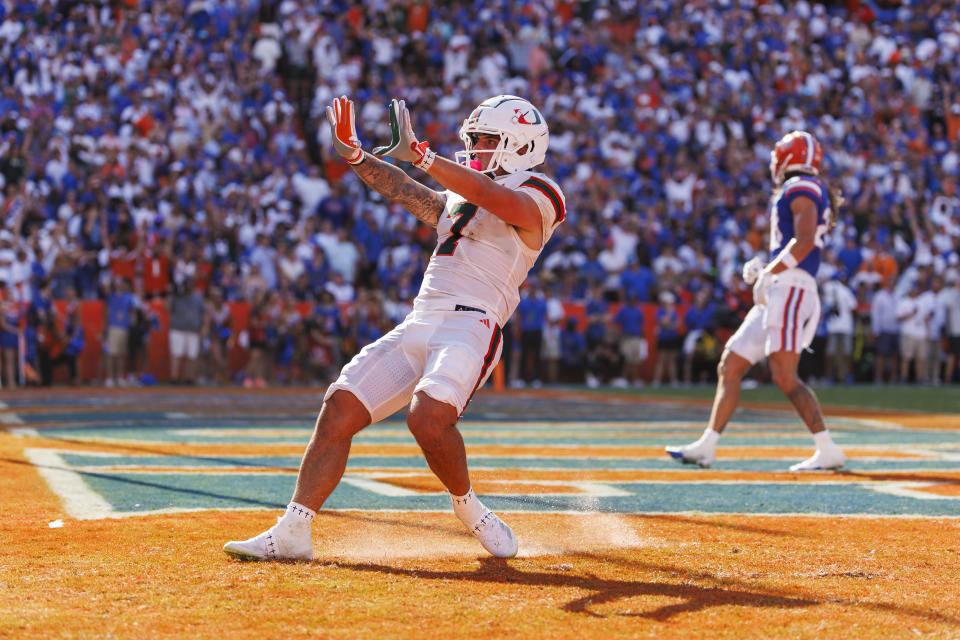 GAINESVILLE, FLORIDA - AUGUST 31: Xavier Restrepo #7 of the Miami Hurricanes celebrates after scoring a touchdown during the first half of a game against the Florida Gators at Ben Hill Griffin Stadium on August 31, 2024 in Gainesville, Florida. (Photo by James Gilbert/Getty Images)