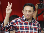 In this Saturday, Feb. 11, 2017 photo, incumbent Jakarta Governor Basuki Tjahaja Purnama greets supporters during a campaign rally in Jakarta, Indonesia. Purnama, popularly known as "Ahok", the first ethnic Chinese governor of Jakarta and the first Christian in more than half a century, had seemed unassailably popular until the accusation of blasphemy, a criminal offense in Indonesia, surfaced in September. Protests against him in November and December, organized by hard-line Islamic groups, drew hundreds of thousands to Jakarta's streets and shook the centrist-minded government of President Joko "Jokowi" Widodo. (AP Photo/Dita Alangkara)