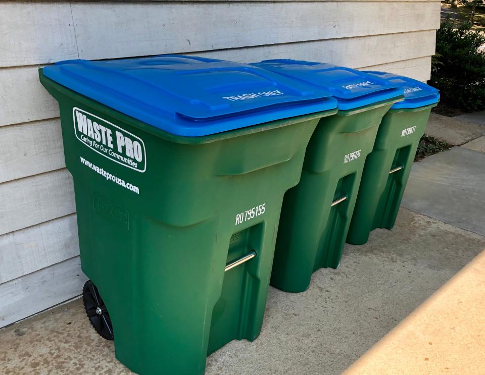 Waste Pro rolling bins.