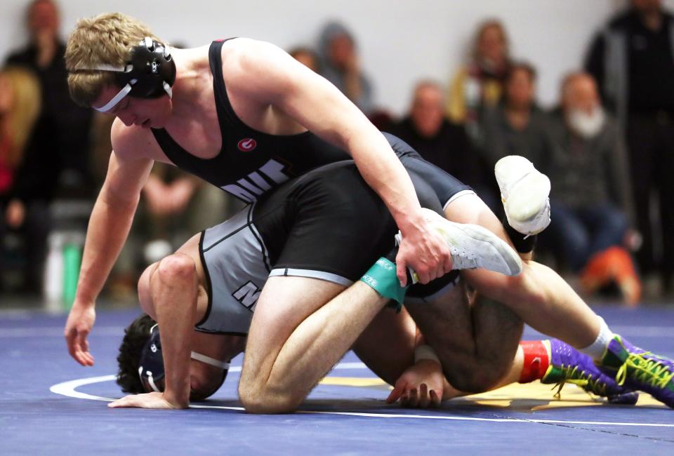 Byram Hills/Briarcliff/Valhalla/Westlake's Thor Giudice and Rye's CJ Luth wrestle in the 170-pound weight class during the dual meet quarterfinals at Byram Hills High School Dec. 19, 2023. Luth won the match.