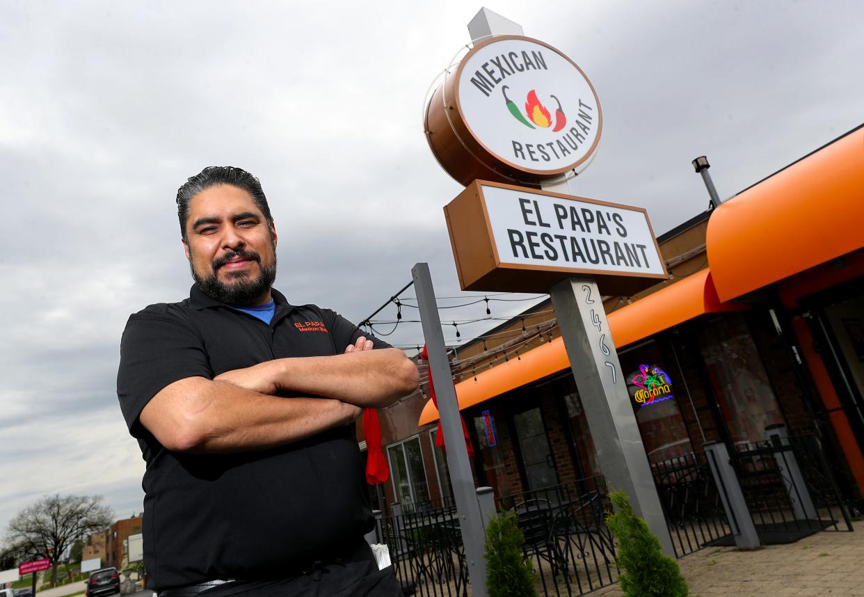 Juan Rodriguez, owner of El Papa's on State Road in Cuyahoga Falls, poses for a photo outside his restaurant in Cuyahoga Falls April 23.