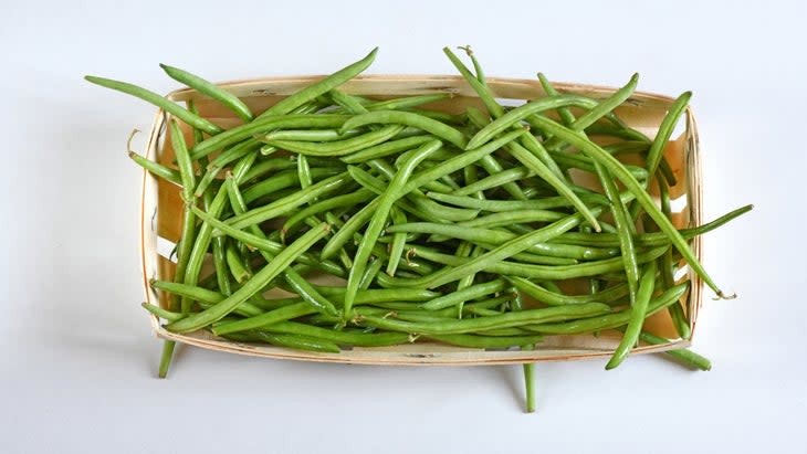 Close-up of beans in bowl on white background