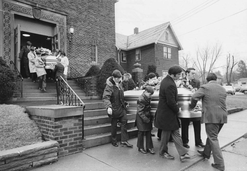 Pallbearers carry the caskets of Paul and Patricia Anthony following a funeral Mass on March 2, 1974, at Sacred Heart Catholic Church in Wadsworth.