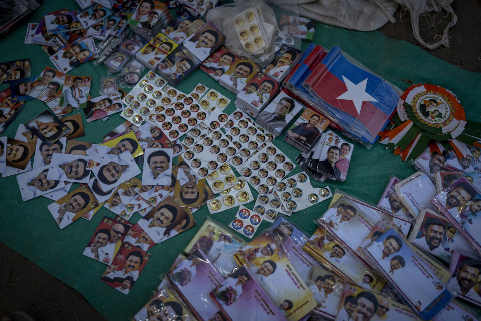 Portraits of Dravida Munnetra Kazhagam (DMK) party leaders and Indian National Congress (INC) leaders and other merchandise is for sale at an election campaign rally ahead of country's general elections, on the outskirts of southern Indian city of Chennai, April 15, 2024. (AP Photo/Altaf Qadri)