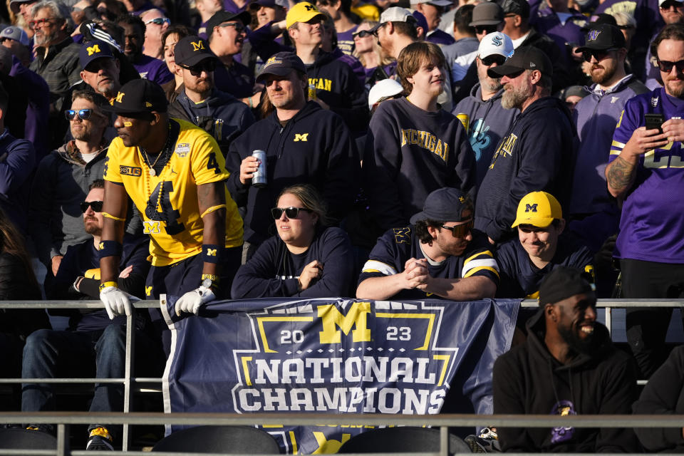 Michigan fans look on from the stands during the first half of an NCAA college football game between Washington and Michigan, Saturday, Oct. 5, 2024, in Seattle. (AP Photo/Lindsey Wasson)