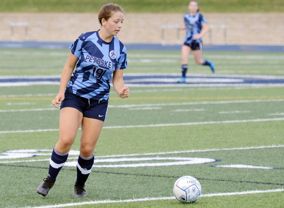 Petoskey's Ann Jones gets ready to send a shot down field against Alpena.