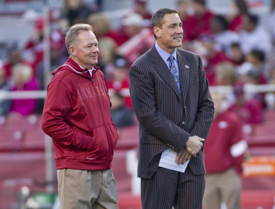 Nov 5, 2011; Fayetteville, AR, USA; Arkansas Razorback head coach Bobby Petrino, left, stands with ESPN analyst Todd Blackledge before the start of a game against the South Carolina Gamecocks at Donald W. Reynolds Stadium. Mandatory Credit: Beth Hall-USA TODAY Sports