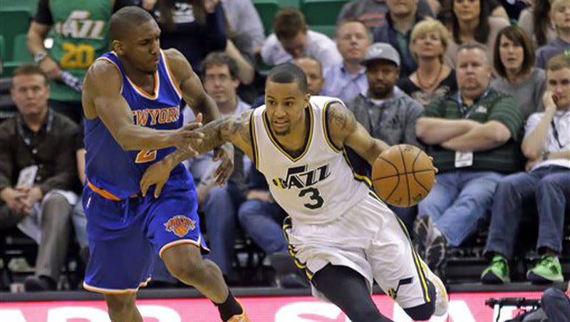 20150310 Utah Jazz guard Trey Burke (3) drives around New York Knicks guard Langston Galloway (2) in the fourth quarter of an NBA basketball game Tuesday, March 10, 2015, in Salt Lake City. The Jazz won 87-82. (AP Photo/Rick Bowmer) Rick Bowmer Trey Burke, Langston Galloway AP