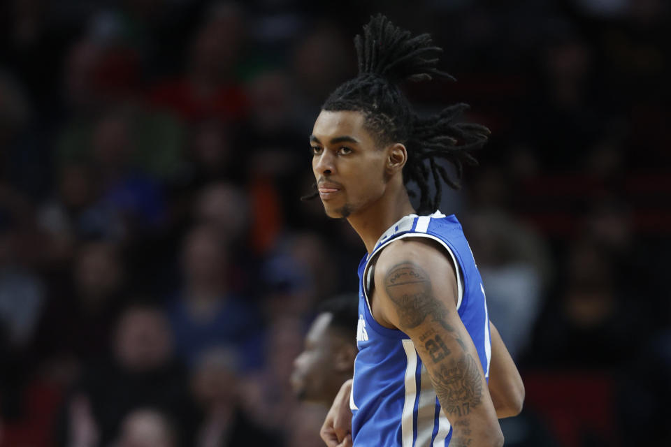 FILE - Memphis forward Emoni Bates stands on the court during the first half of a first round NCAA college basketball tournament game against Boise State, Thursday, March 17, 2022, in Portland, Ore. Emoni Bates, a former basketball prodigy who attends Eastern Michigan, has been charged with two felonies after authorities say they found a firearm during a traffic stop. Washtenaw County Sheriff spokesman Derrick Jackson said deputies Bates was pulled over after he failed to stop at an intersection Sunday night, Sept. 18. (AP Photo/Craig Mitchelldyer)