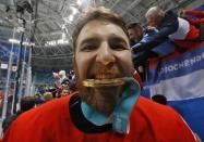 Ice Hockey - Pyeongchang 2018 Winter Olympics - Men Final Match - Olympic Athletes from Russia v Germany - Gangneung Hockey Centre, Gangneung, South Korea - February 25, 2018 -Nikita Nesterov, an Olympic Athlete from Russia, poses with his gold medal. REUTERS/Kim Kyung-Hoon