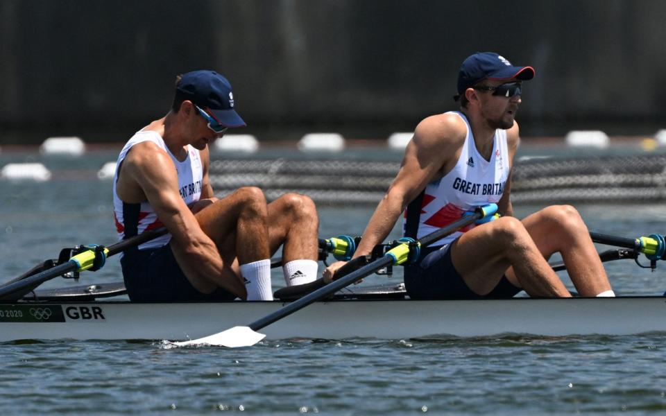 Britain's Graeme Thomas and Britain's John Collins - AFP