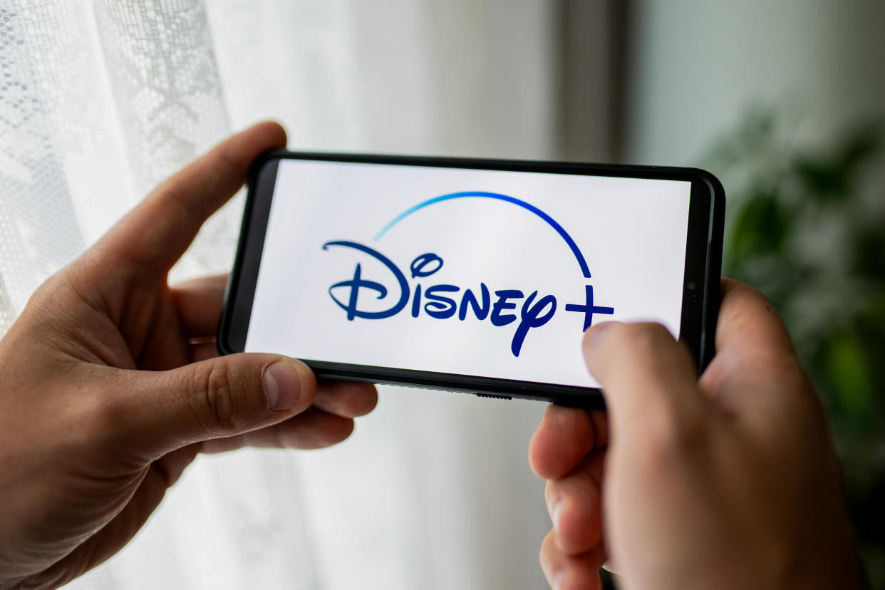 POLAND - 2023/07/13: In this photo illustration a Disney + logo seen displayed on a smartphone. (Photo Illustration by Mateusz Slodkowski/SOPA Images/LightRocket via Getty Images)