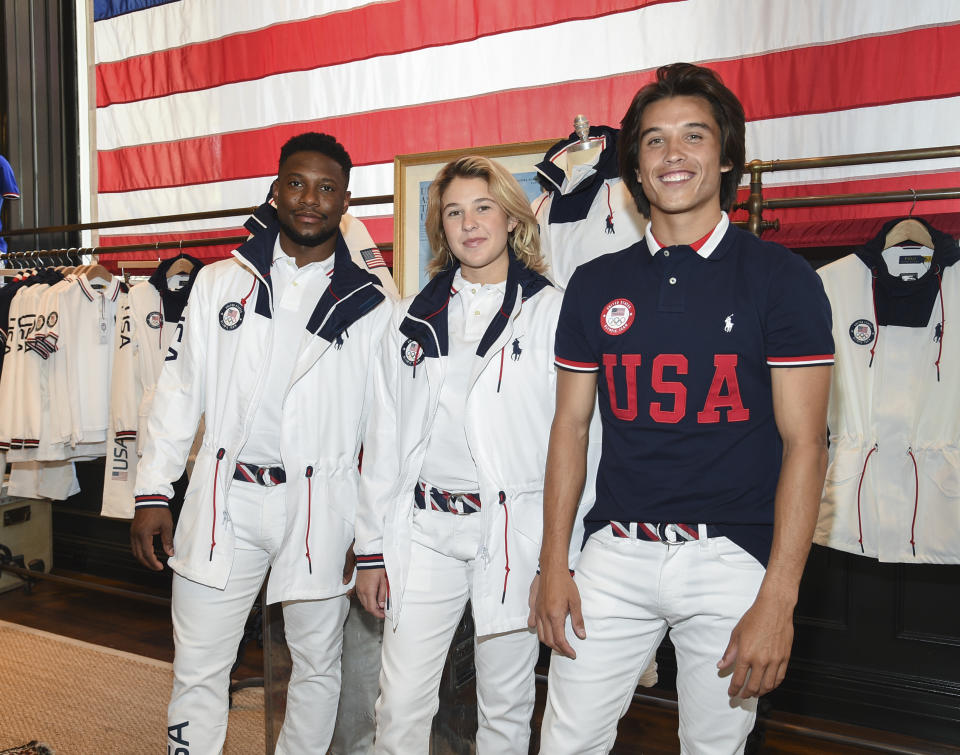 Athletes Daryl Homer (Fencing), from left, Jordyn Barratt (Skateboard) and Heimana Reynolds (Skateboard) participate in the Team USA Tokyo Olympic closing ceremony uniform unveiling at the Ralph Lauren SoHo Store on April 13, 2021, in New York. Ralph Lauren is an official outfitter of the 2021 U.S. Olympic Team. (Photo by Evan Agostini/Invision/AP)